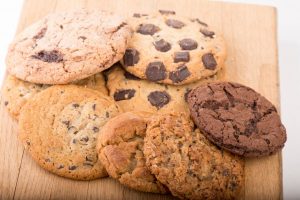 Tasty Pastry Cookies: 8 different types of cookies assorted on a wooden surface