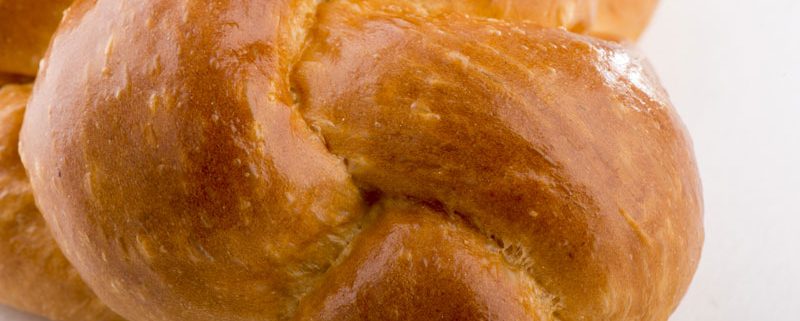 Tasty Pastry Tasty Treats: Close-up on glazed, plaited bread