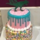 Two-tiered Sprinkles and Drip Dinosaur Birthday Cake